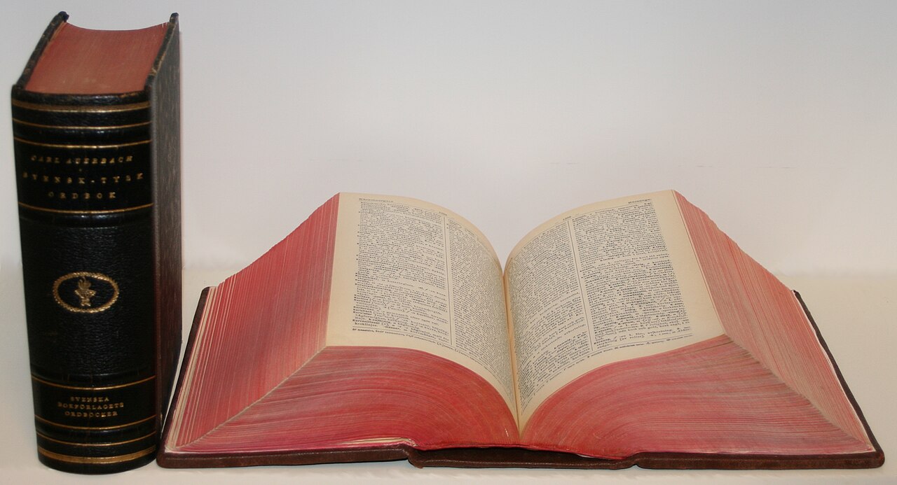 Swedish-German (upright) and German-Swedish (laying open) dictionaries by Carl Auerbach